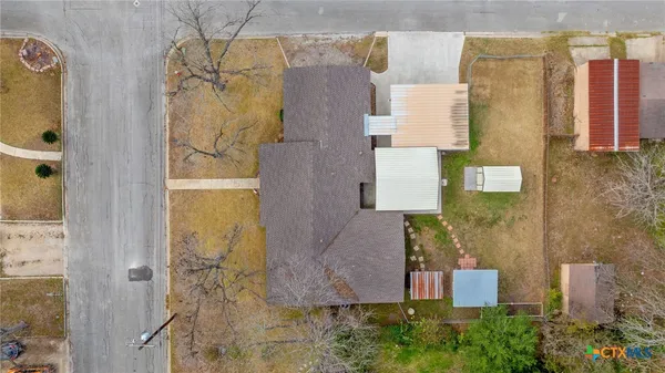 an aerial view of residential houses with outdoor space