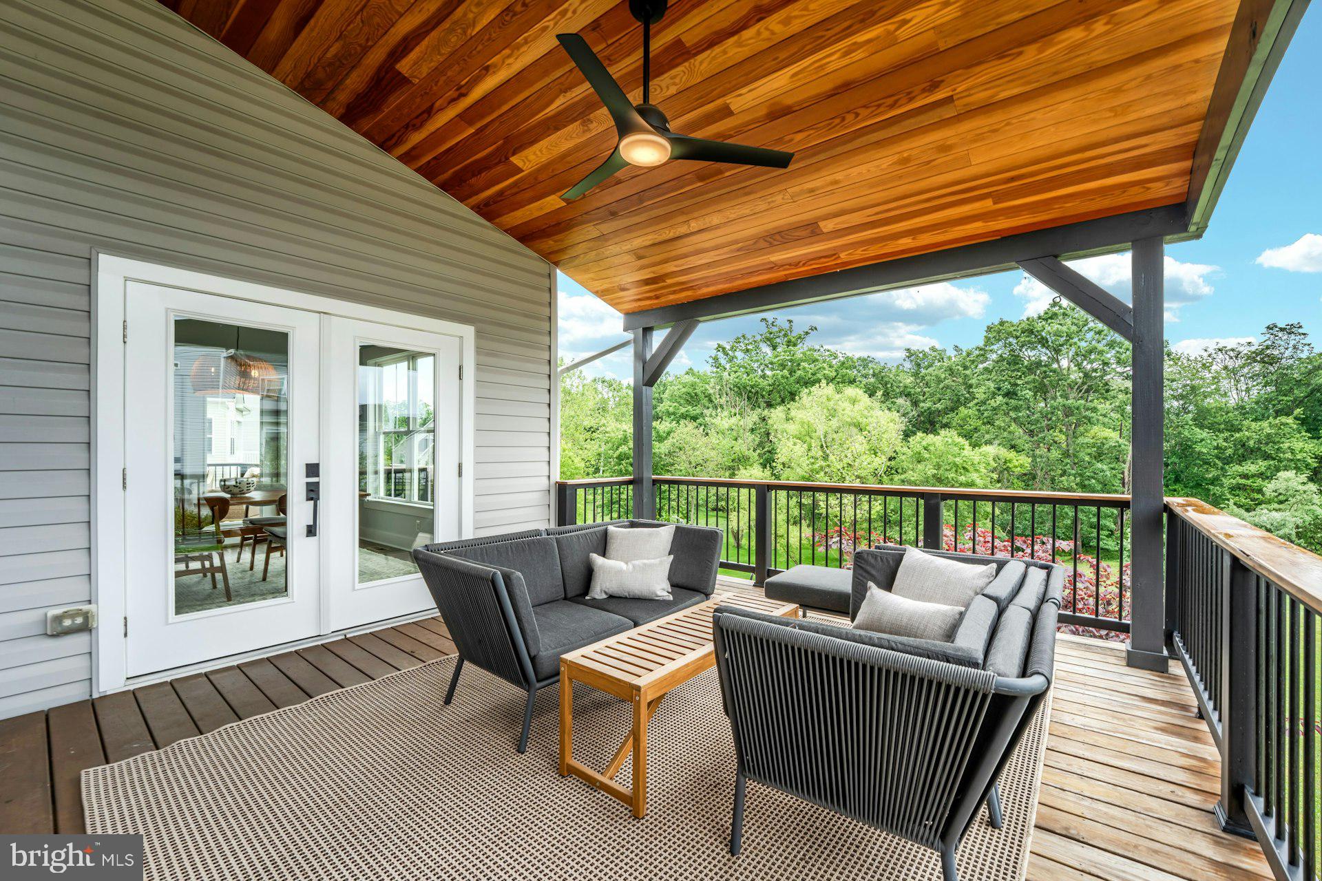 18120 Ridgewood Place Round Hill, VA 20141 - Photo 12 of 46 a balcony with furniture and garden view