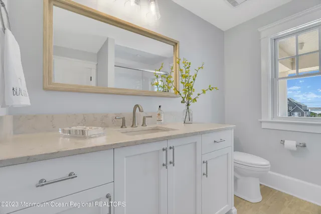 a kitchen with cabinets and window