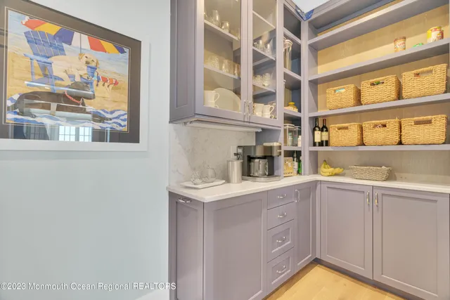 a bathroom with a toilet sink vanity and mirror
