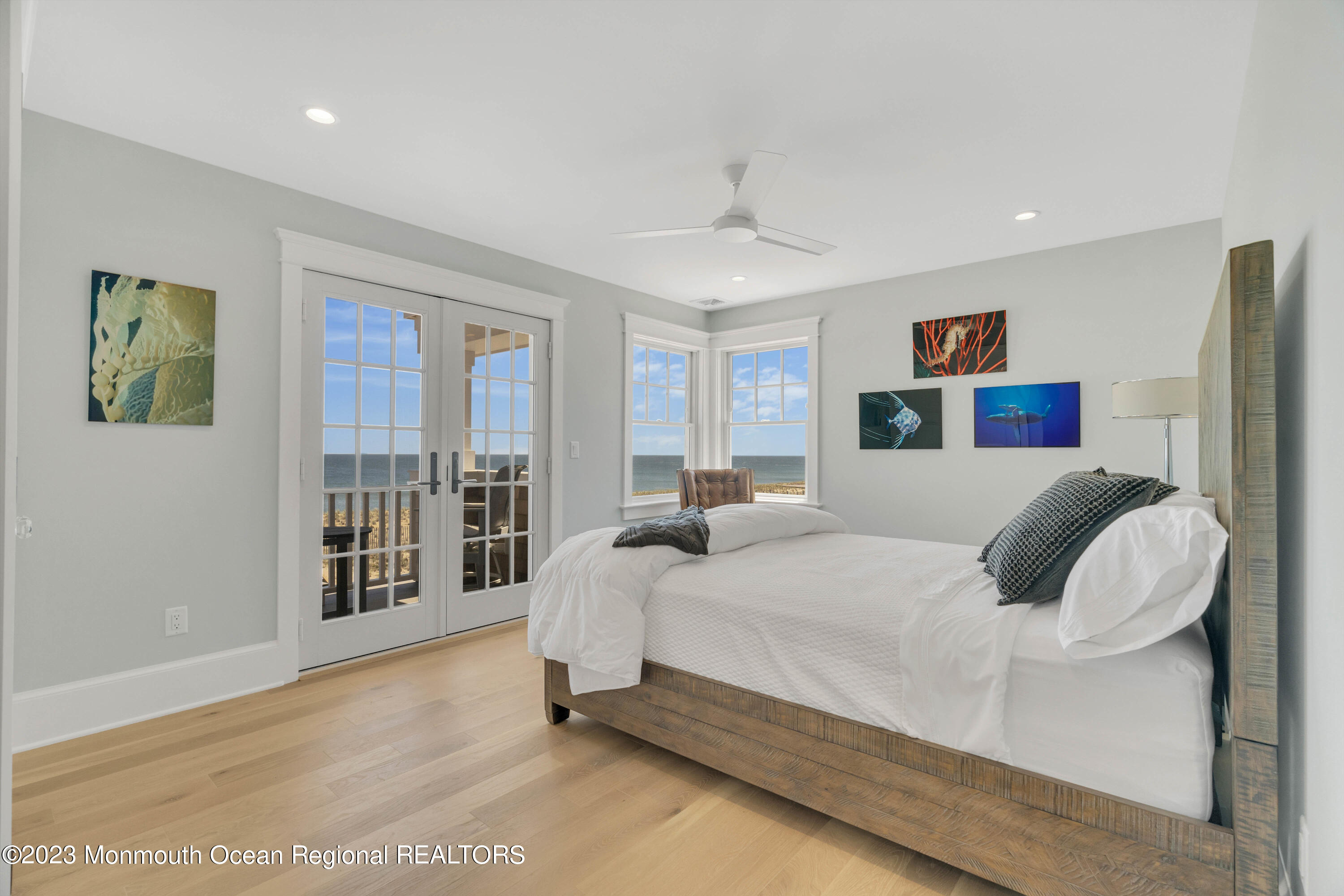 1407 Ocean Avenue Mantoloking, NJ 08738 - Photo 19 of 41 a bedroom with a bed and glass door