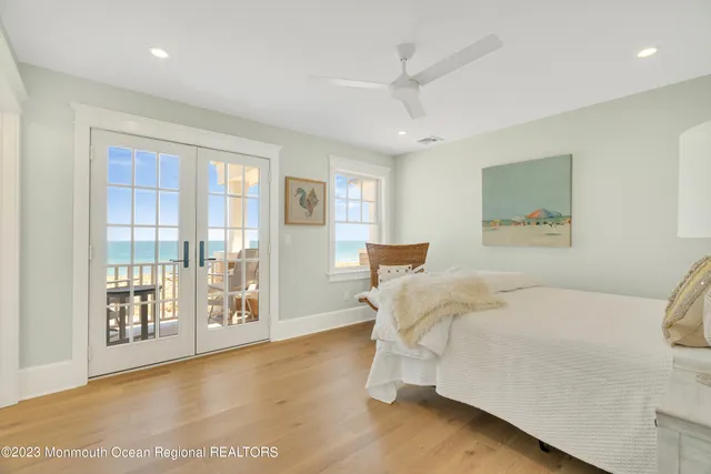 a spacious bedroom with a bed and a large window