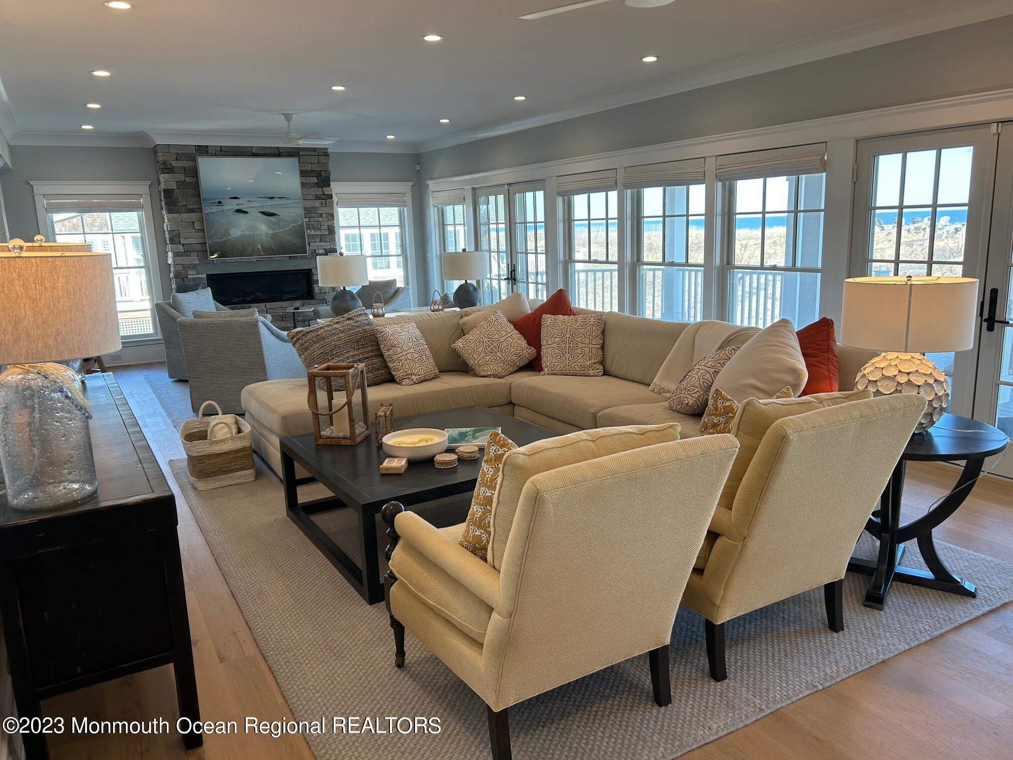 1407 Ocean Avenue Mantoloking, NJ 08738 - Photo 4 of 41 a living room with furniture and a fireplace