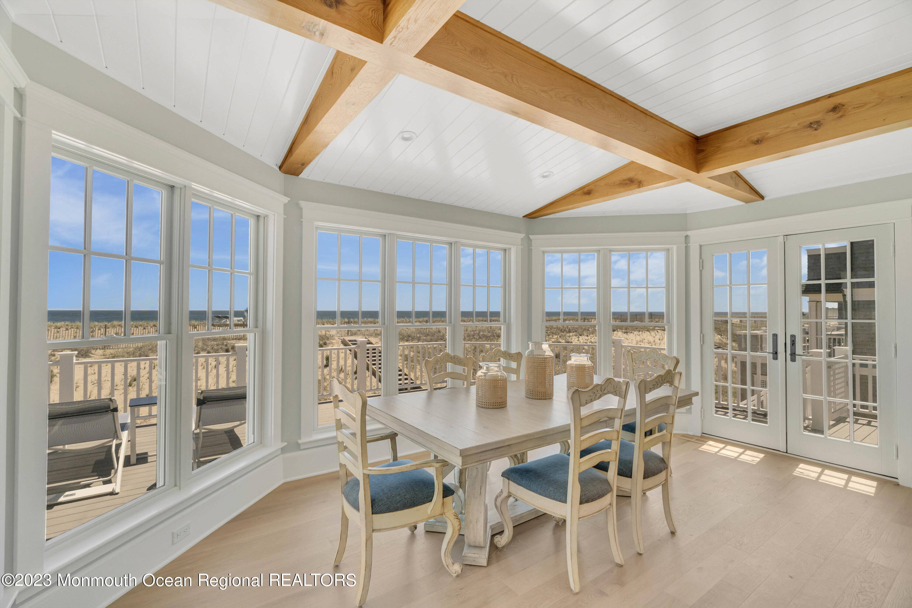 1407 Ocean Avenue Mantoloking, NJ 08738 - Photo 8 of 41 a dining room with furniture and floor to ceiling window