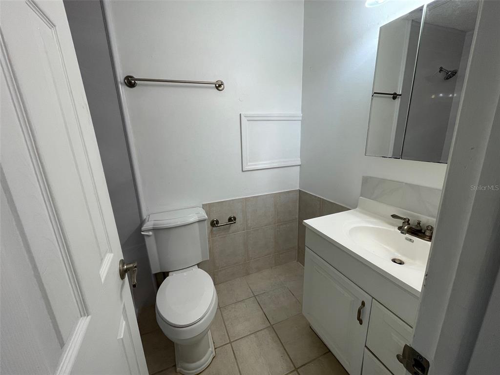 9000 Griggs Road, Unit C Englewood, FL 34224 - Photo 12 of 14 a bathroom with a sink toilet and shower
