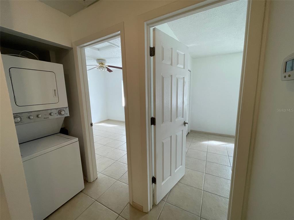 9000 Griggs Road, Unit C Englewood, FL 34224 - Photo 14 of 14 a view of bathroom and utility room