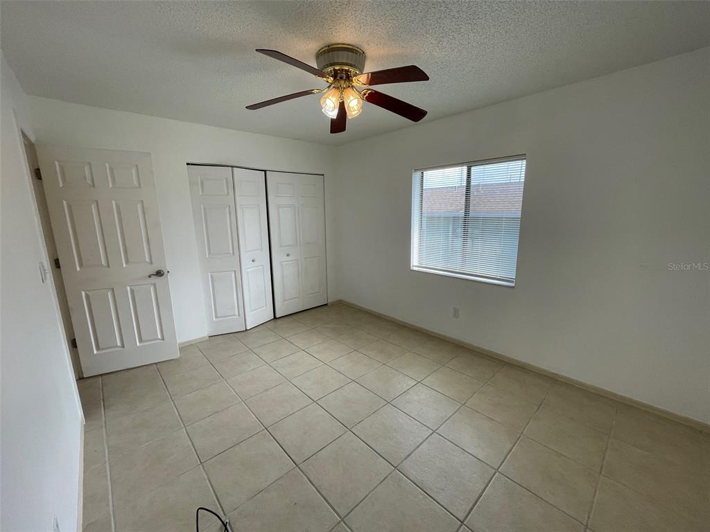 9000 Griggs Road, Unit C Englewood, FL 34224 - Photo 8 of 14 a view of an empty room with a window