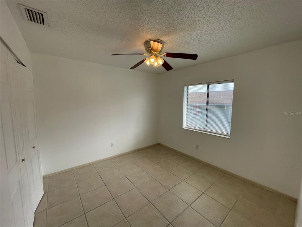 9000 Griggs Road, Unit C Englewood, FL 34224 - Photo 10 of 14 a view of empty room with window