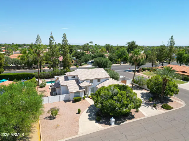 an aerial view of a house with outdoor space