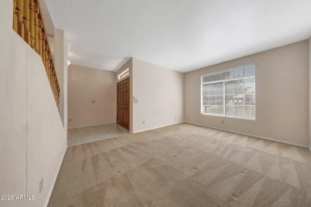 a view of a kitchen cabinets and a window