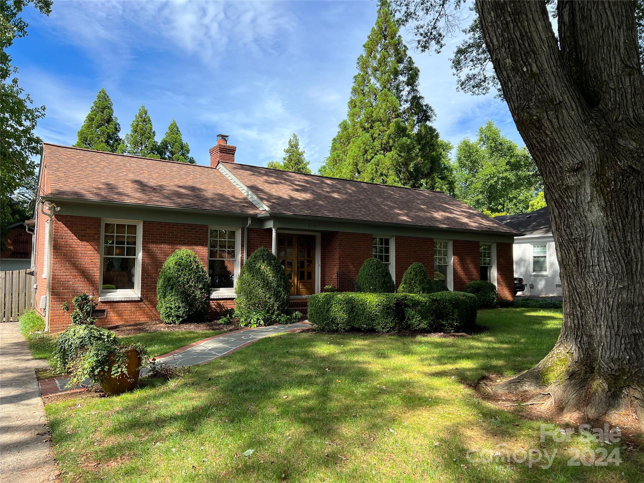 4115 Rutherford Drive Charlotte, NC 28210 - Photo 1 of 26 a view of a house with garden and plants