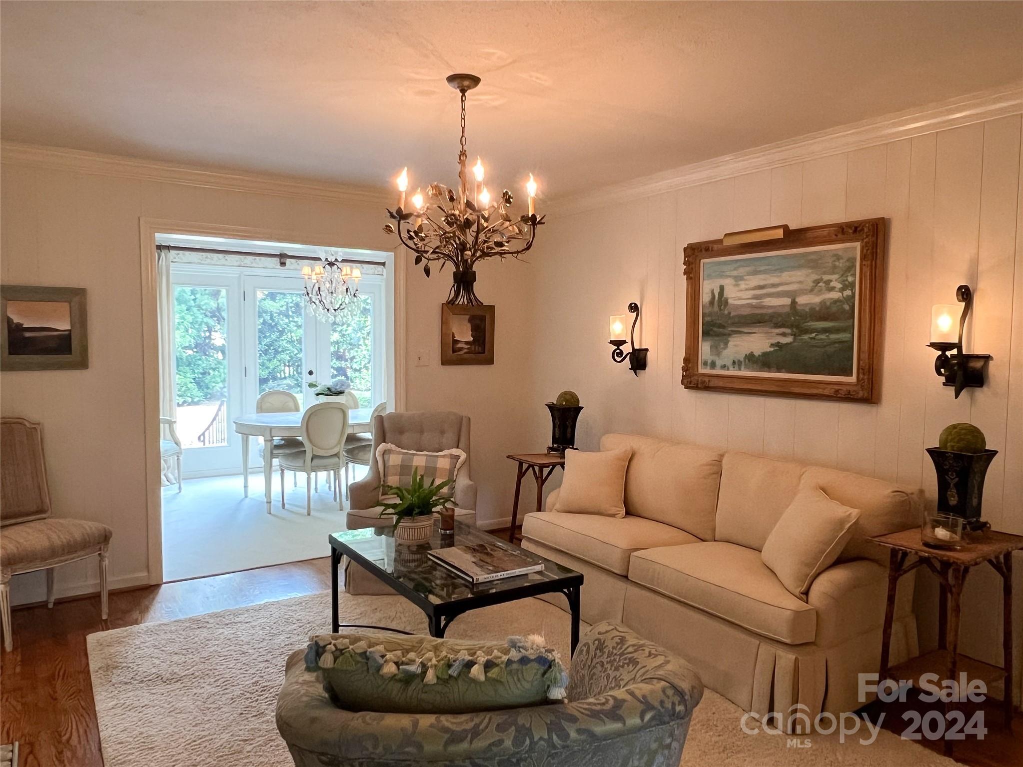 4115 Rutherford Drive Charlotte, NC 28210 - Photo 12 of 26 a living room with furniture and a chandelier