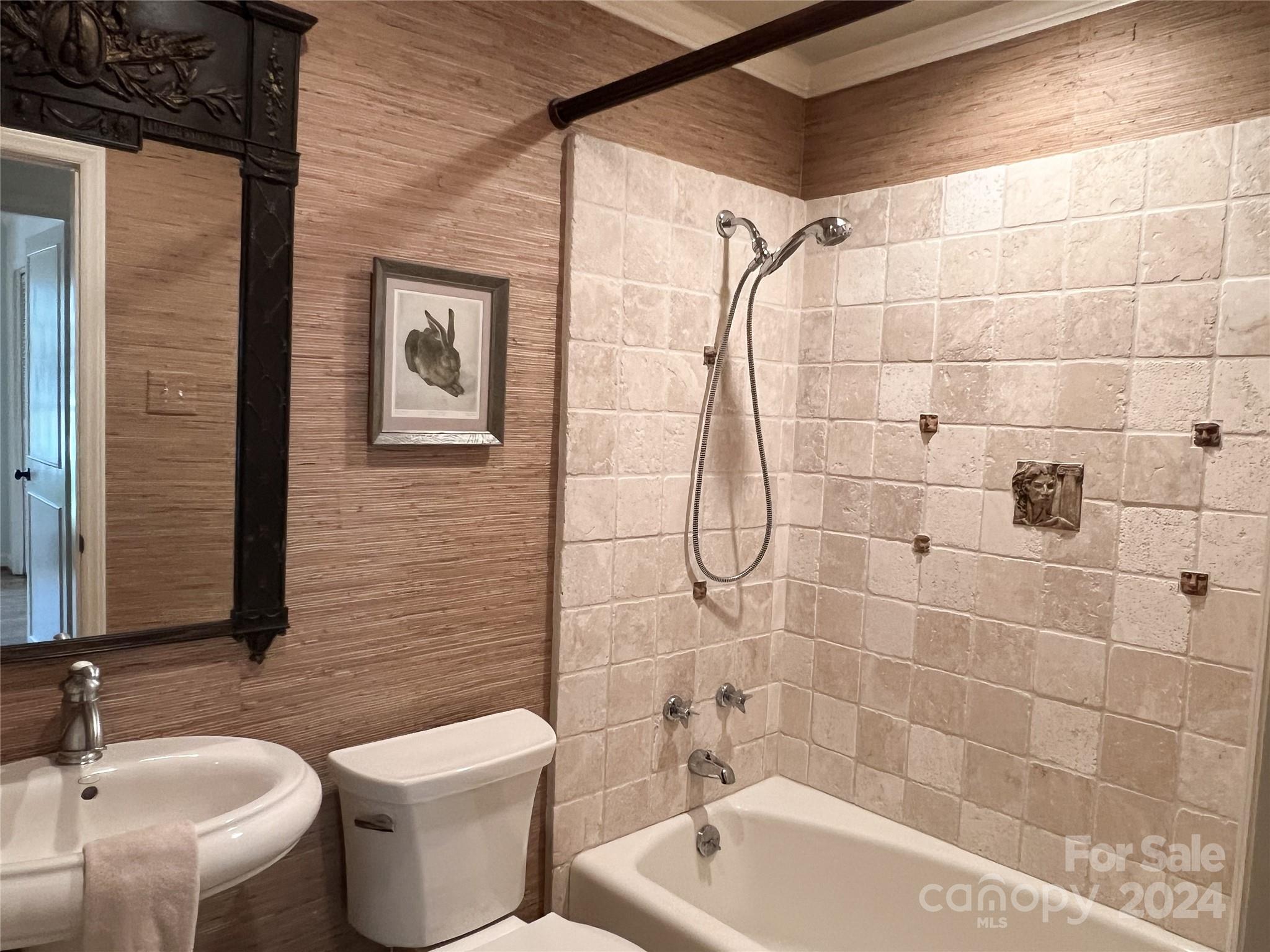 4115 Rutherford Drive Charlotte, NC 28210 - Photo 17 of 26 a bathroom with a sink a toilet and shower