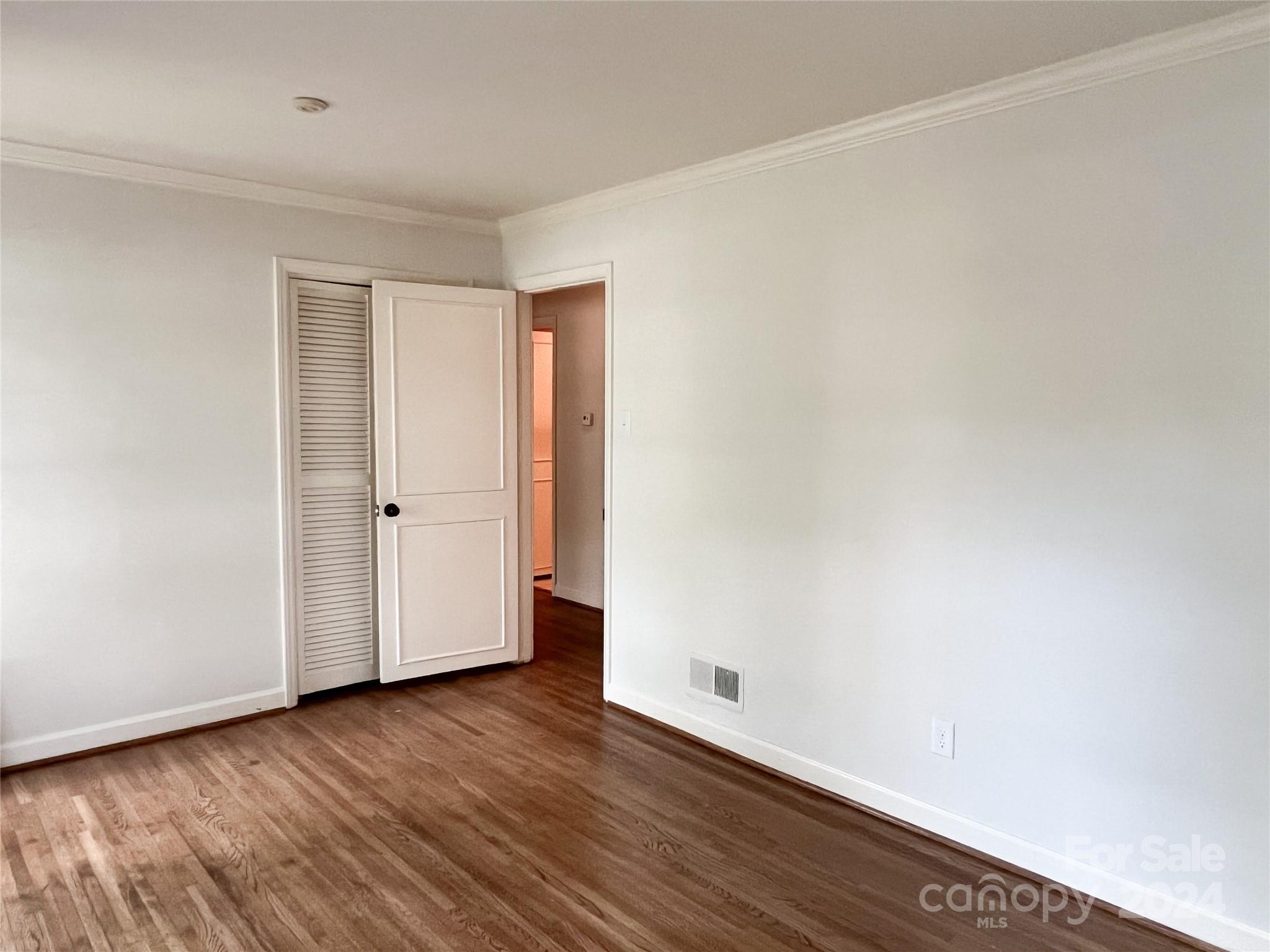 4115 Rutherford Drive Charlotte, NC 28210 - Photo 19 of 26 a view of an empty room with wooden floor