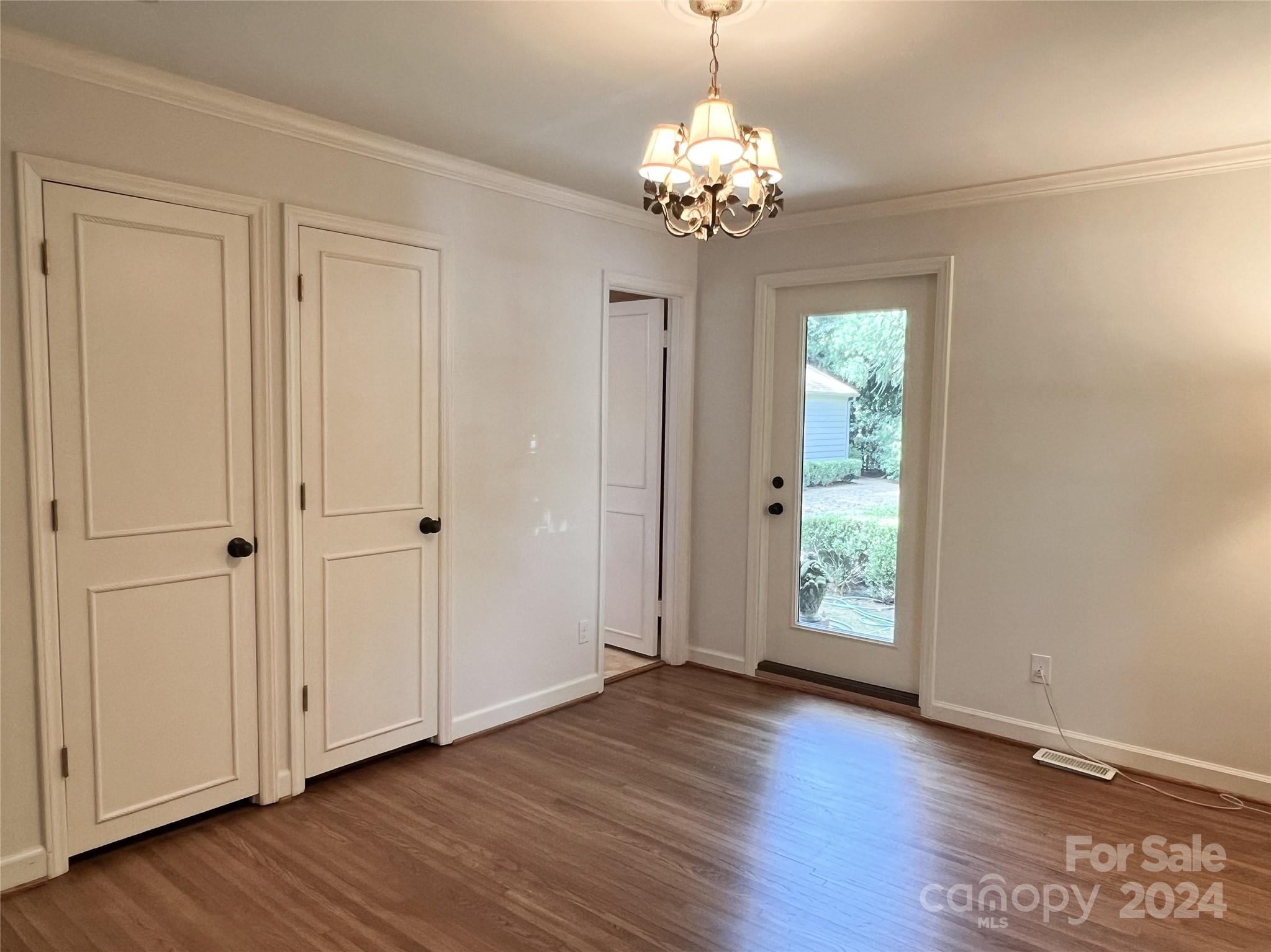 4115 Rutherford Drive Charlotte, NC 28210 - Photo 21 of 26 a view of an empty room with wooden floor