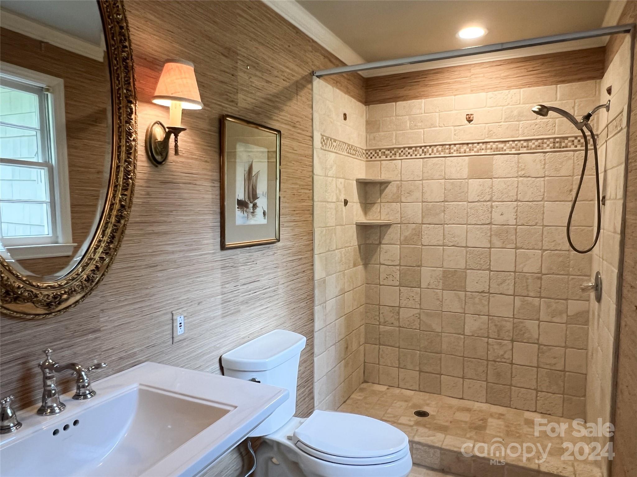 4115 Rutherford Drive Charlotte, NC 28210 - Photo 23 of 26 a bathroom with a sink a toilet and shower