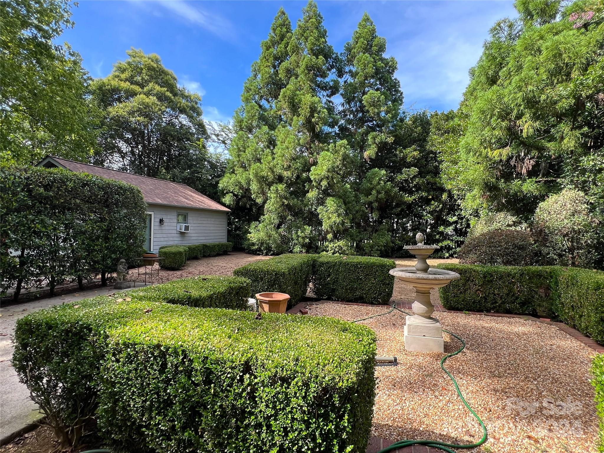 4115 Rutherford Drive Charlotte, NC 28210 - Photo 24 of 26 a front view of a house with garden