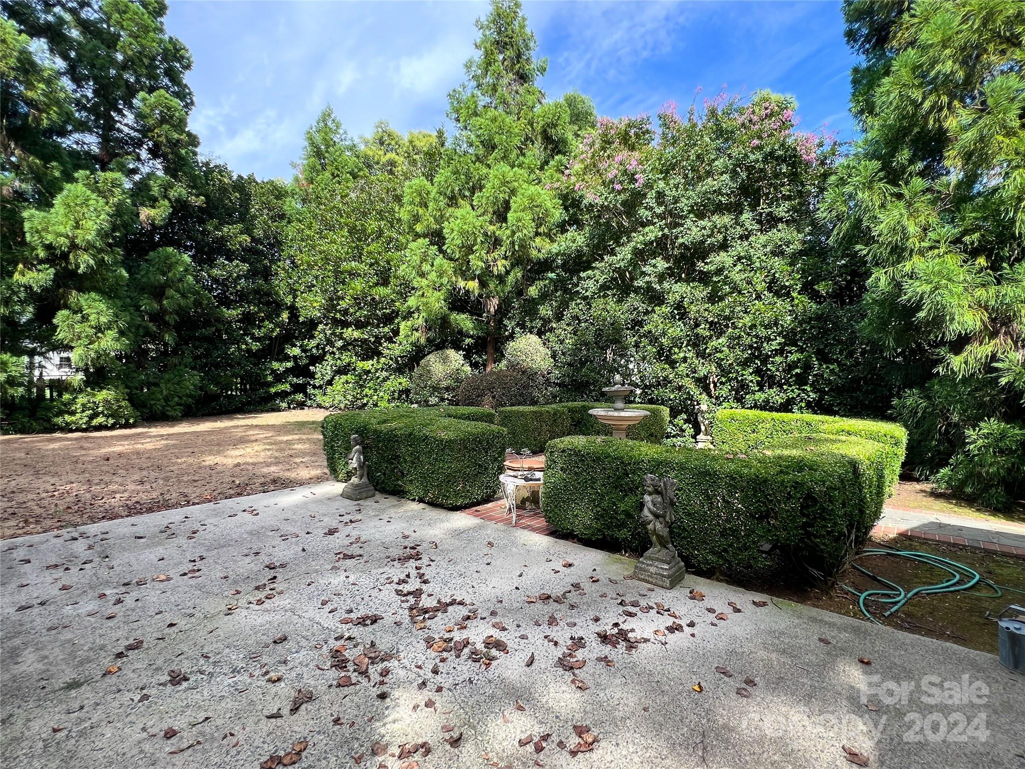 4115 Rutherford Drive Charlotte, NC 28210 - Photo 25 of 26 a view of a backyard with plants