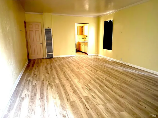 a view of a bathroom with a sink and a mirror