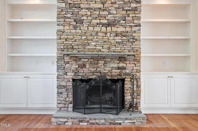 a view of staircase with white walls and a wooden floor