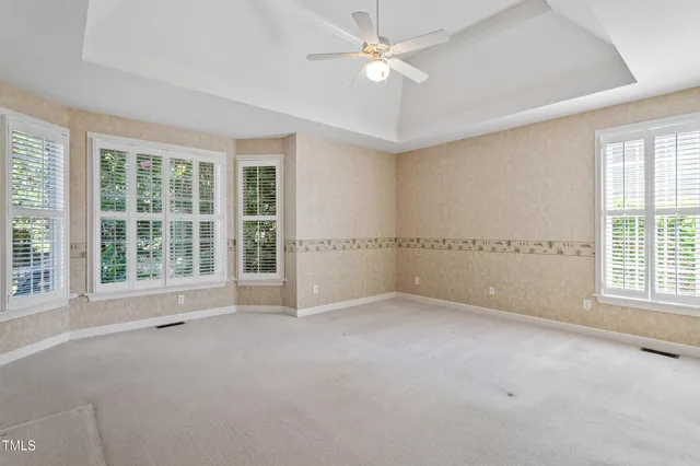 a spacious bathroom with a granite countertop sink mirror and double