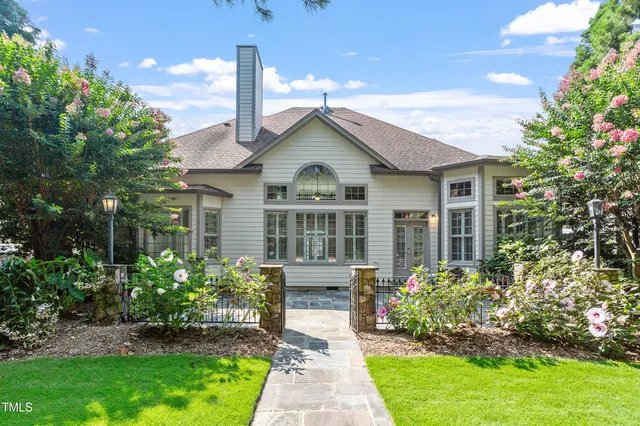 a view of a backyard with large trees