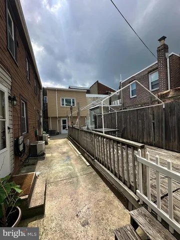 a view of a balcony with chairs