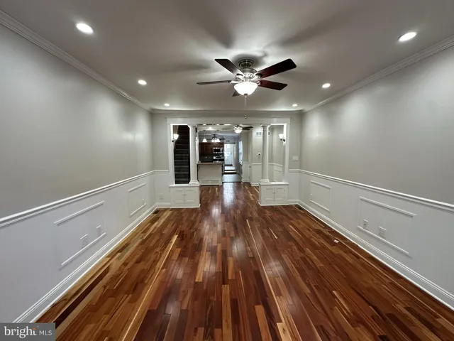 a view of gallery with wooden floor