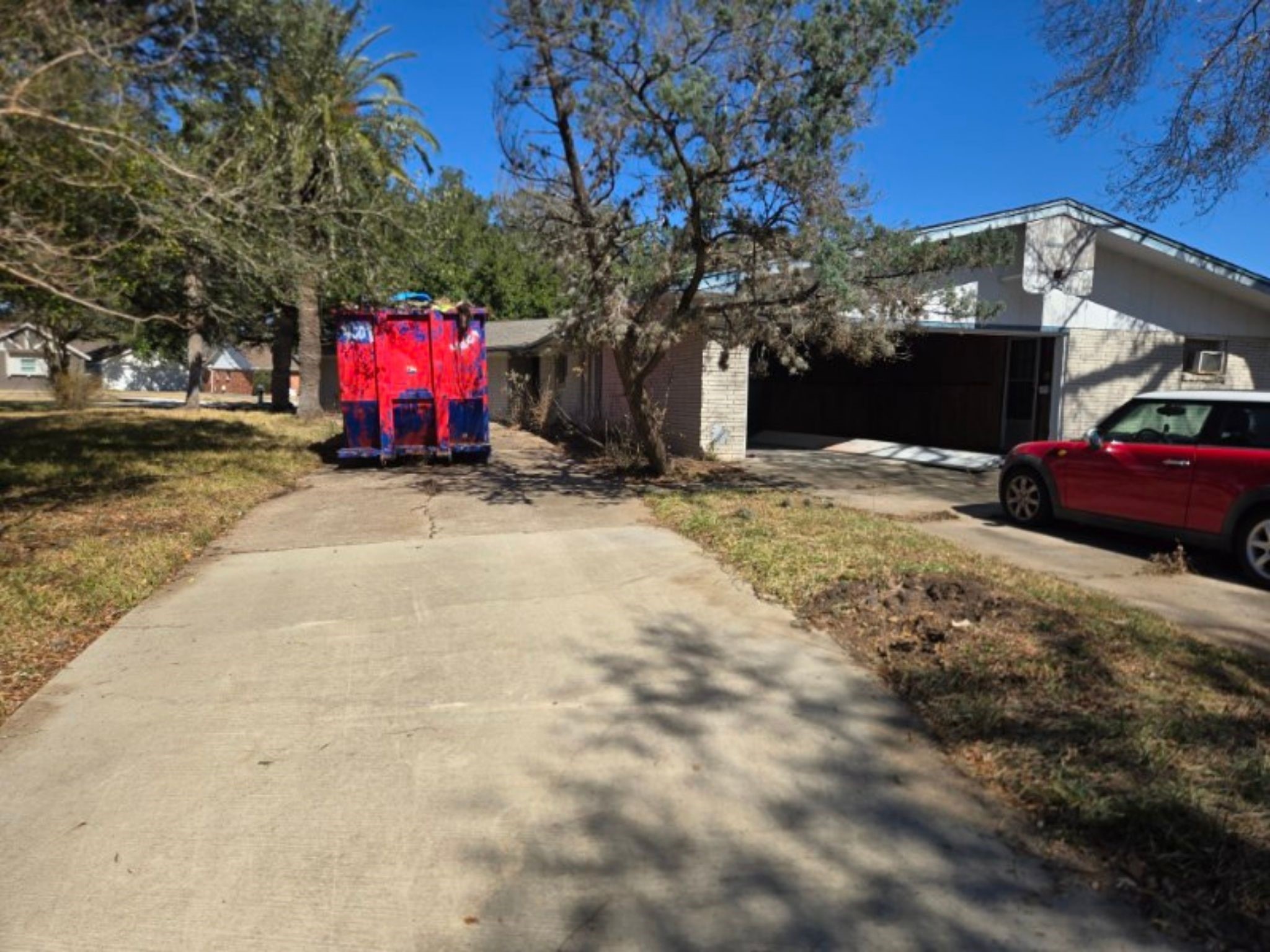 5006 Interlachen Street Baytown, TX 77521 - Photo 2 of 26 a view of a fire pit with large trees