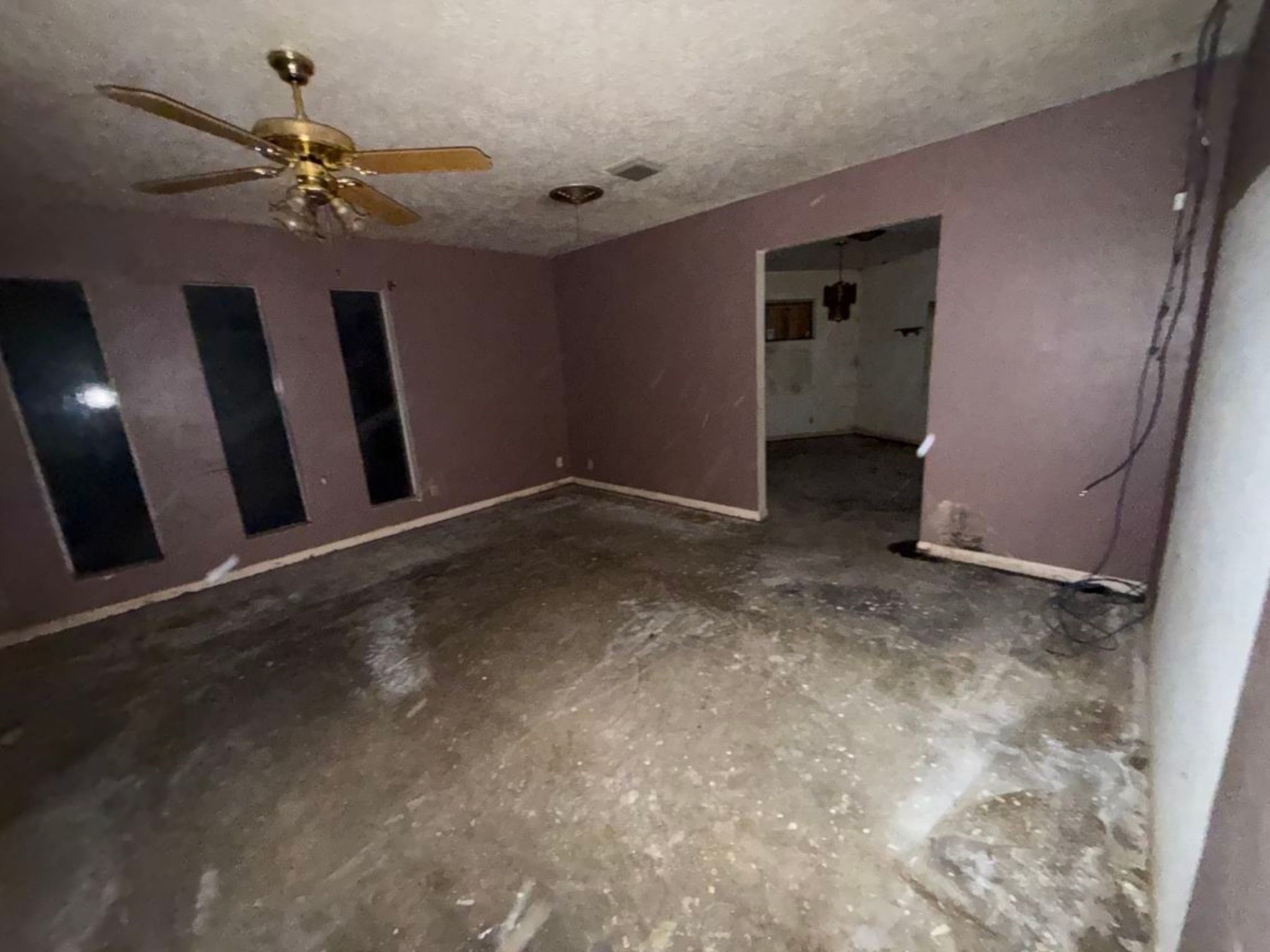 5006 Interlachen Street Baytown, TX 77521 - Photo 25 of 26 a view of a livingroom with hardwood floor and a ceiling fan