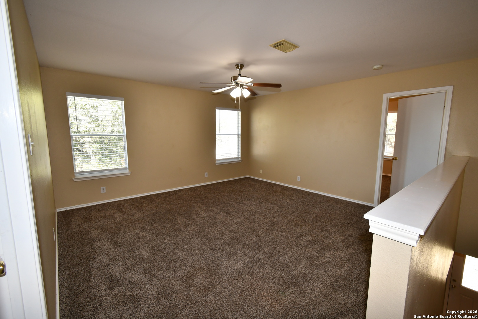 8834 Ridgefront San Antonio, TX 78250 - Photo 16 of 20 a view of empty room with window
