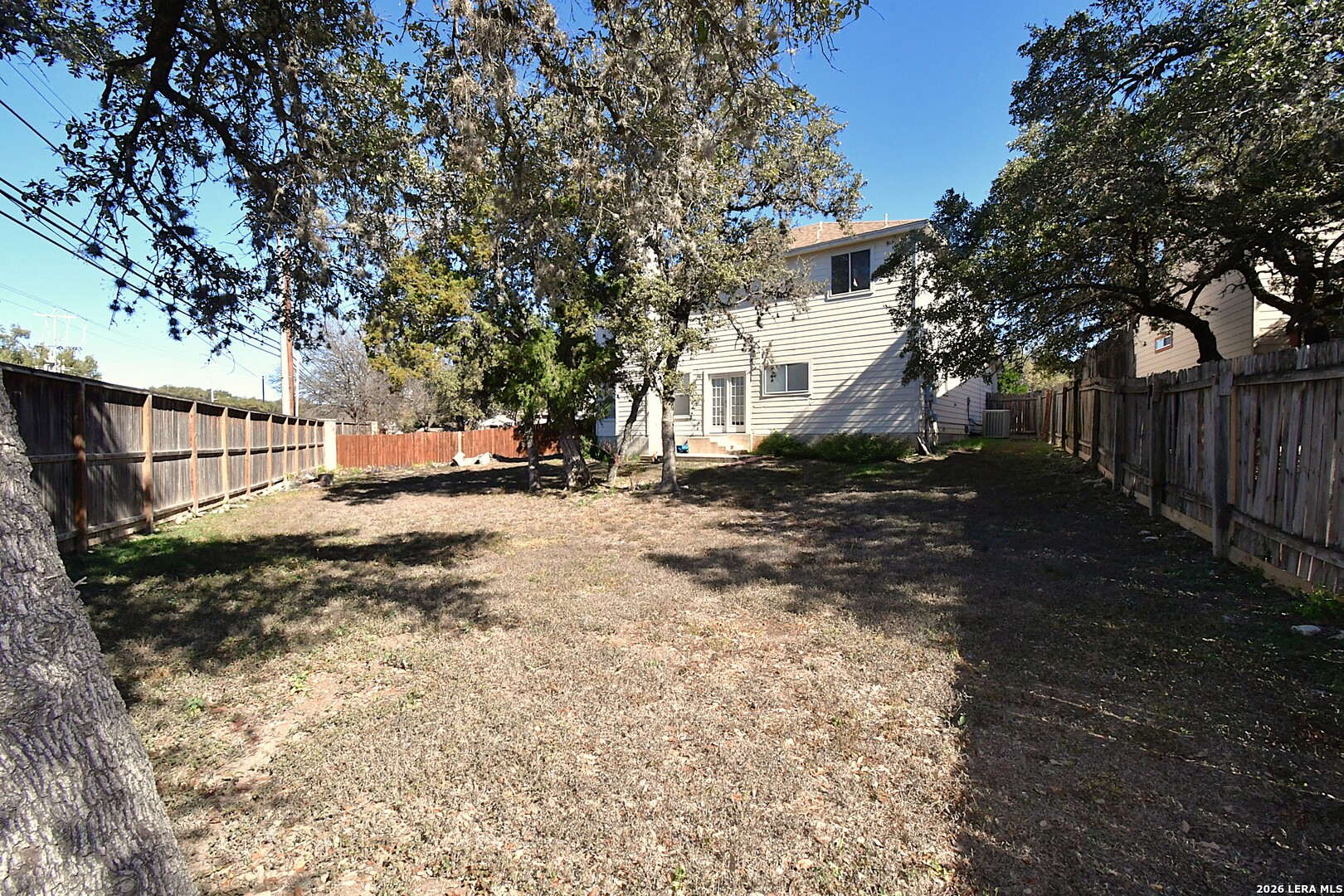 8834 Ridgefront San Antonio, TX 78250 - Photo 20 of 20 a view of a yard with a tree