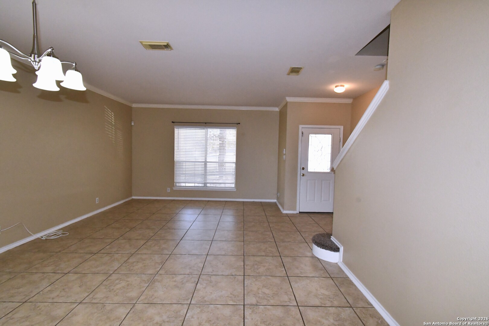 8834 Ridgefront San Antonio, TX 78250 - Photo 4 of 20 a view of an empty room with a window