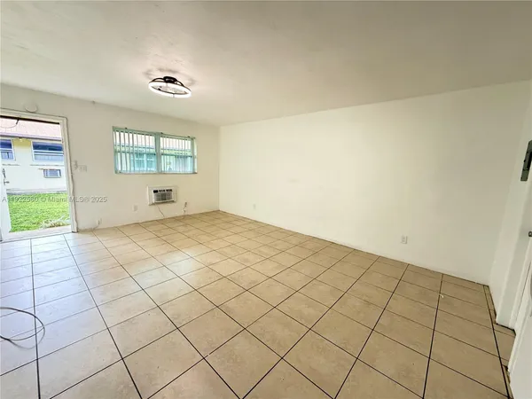 a view of an empty room and window