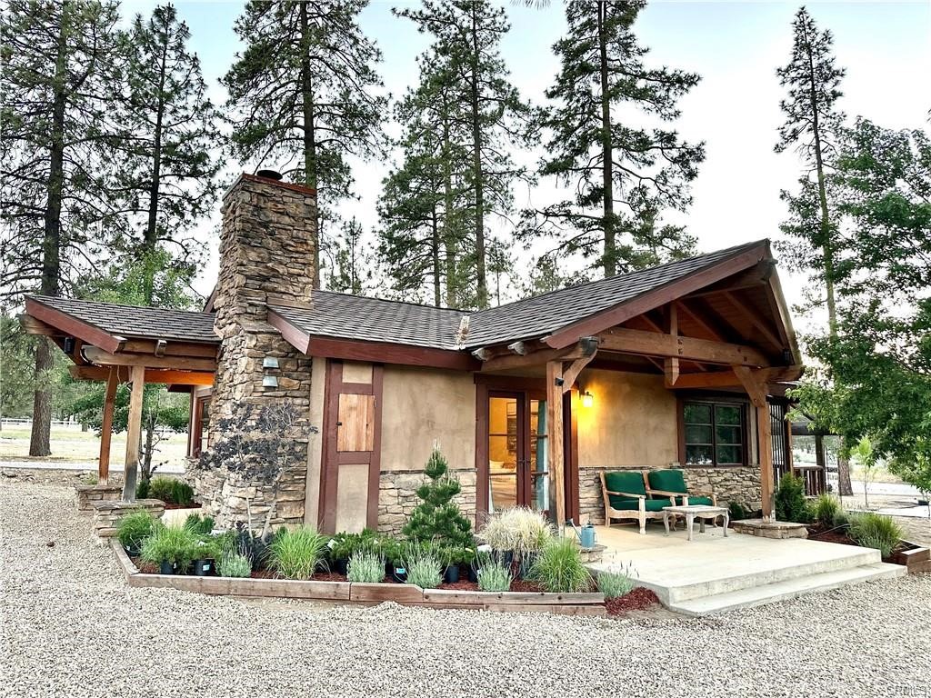 35650 Pyramid Peak Road Mountain Center, CA 92561 - Photo 2 of 24 a patio with a table and chairs and potted plants