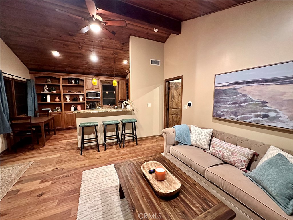 35650 Pyramid Peak Road Mountain Center, CA 92561 - Photo 22 of 24 a living room with furniture and a flat screen tv