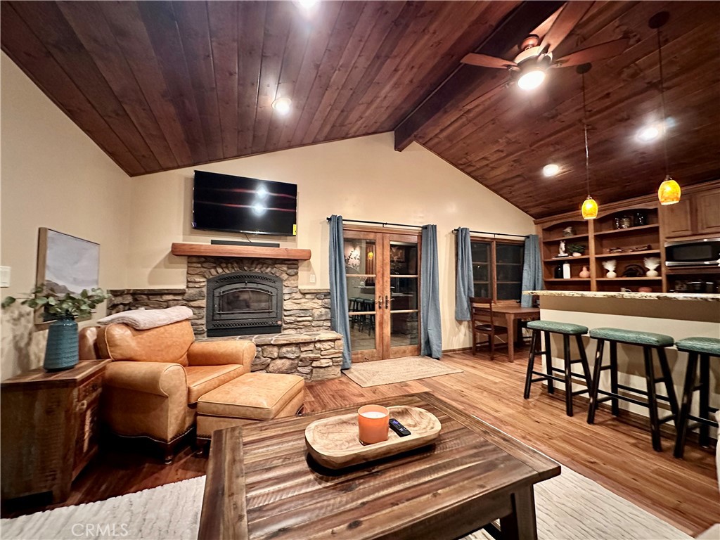 35650 Pyramid Peak Road Mountain Center, CA 92561 - Photo 23 of 24 a living room with furniture a flat screen tv and kitchen view