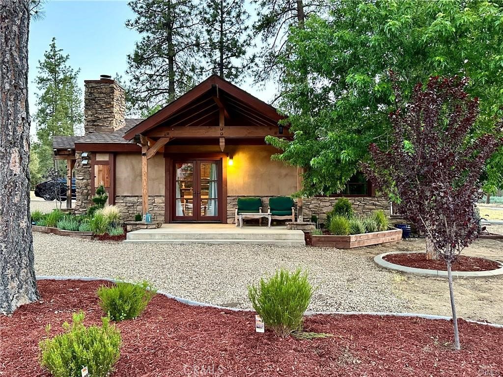 35650 Pyramid Peak Road Mountain Center, CA 92561 - Photo 6 of 24 a view of a chair and table in backyard of the house