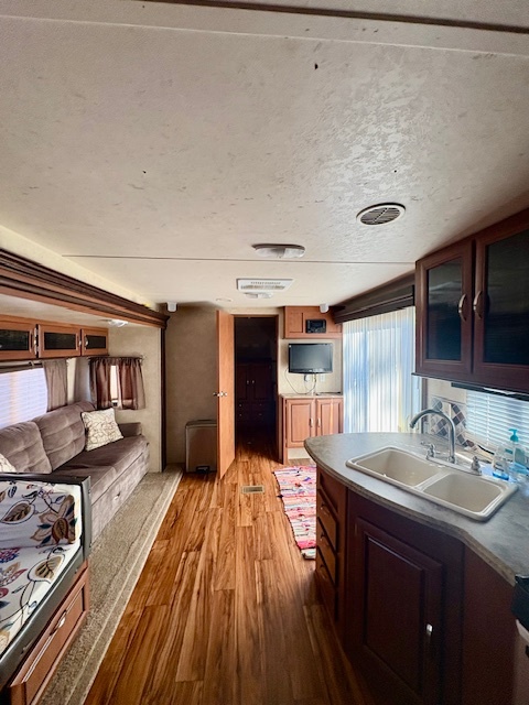 5-308 Woodhaven Sublette, IL 61367 - Photo 11 of 30 a spacious bathroom with a granite countertop sink and a mirror