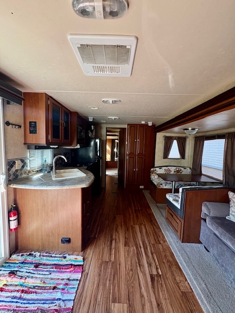 5-308 Woodhaven Sublette, IL 61367 - Photo 14 of 30 a living room with stainless steel appliances granite countertop a stove and a wooden floors