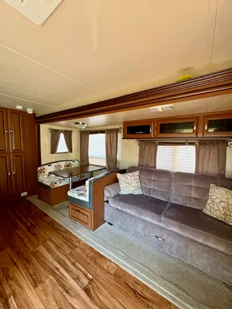 a living room with furniture and a rug