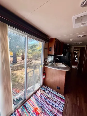 a room with furniture and a floor to ceiling window