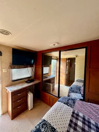 a bedroom with a bed and cabinets