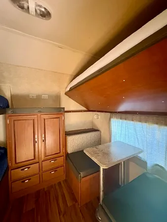 a en suite bathroom with a granite countertop sink and a mirror