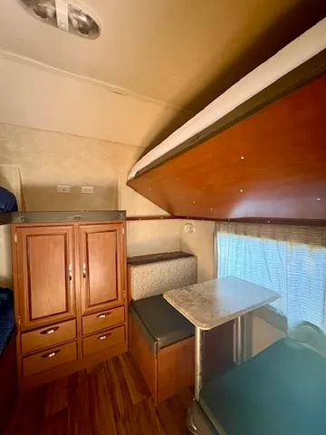 a en suite bathroom with a granite countertop sink and a mirror