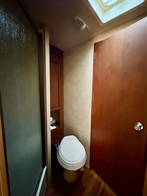 5-308 Woodhaven Sublette, IL 61367 - Photo 24 of 30 a bathroom with a toilet and a shower