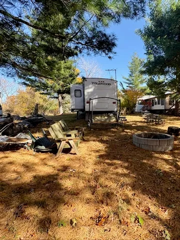 a view of a swimming pool with outdoor seating