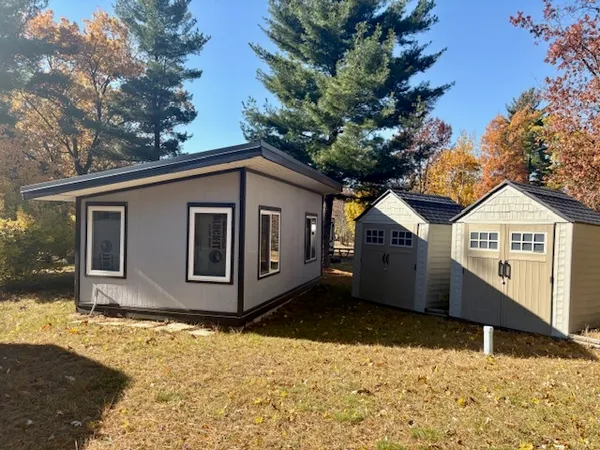 a view of a house with a yard