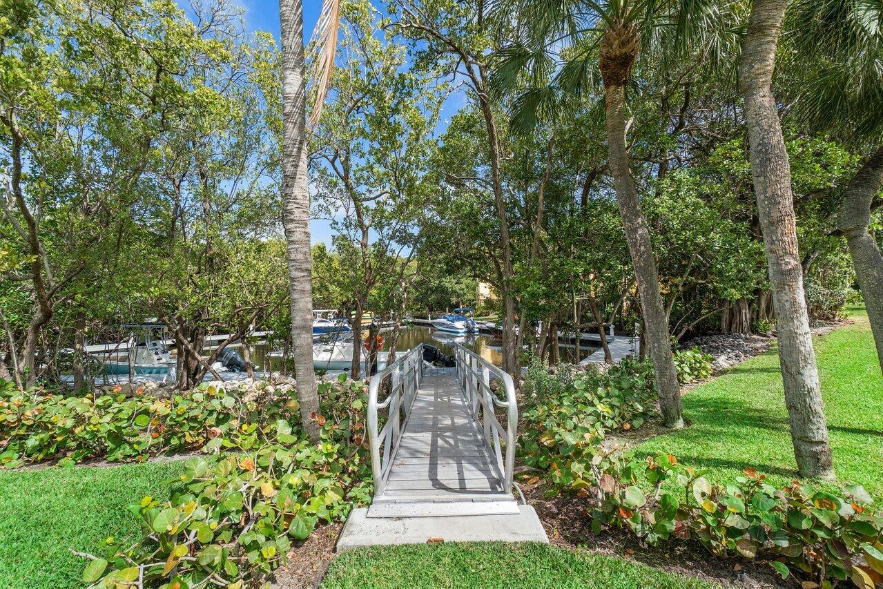 5580 North Ocean Boulevard, Unit 29F Ocean Ridge, FL 33435 - Photo 46 of 62 Walkway to Lagoon Dock