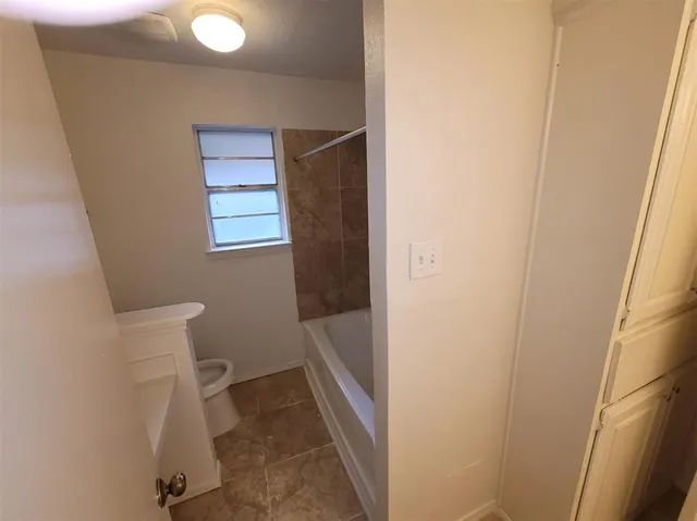 a bathroom with a sink and toilet